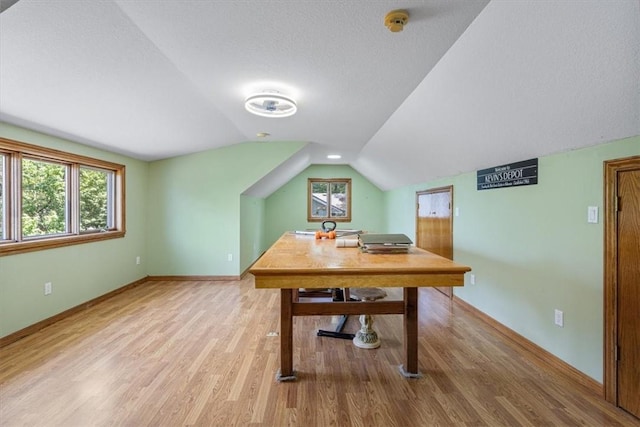 5 Augusta Ln, Holiday Island, AR 72631 - office featuring vaulted ceiling, light wood-style flooring, baseboards, and a textured ceiling