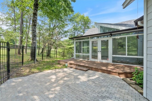 5 Augusta Ln, Holiday Island, AR 72631 - fenced backyard with a sunroom, french doors, a wooden deck, and a patio area