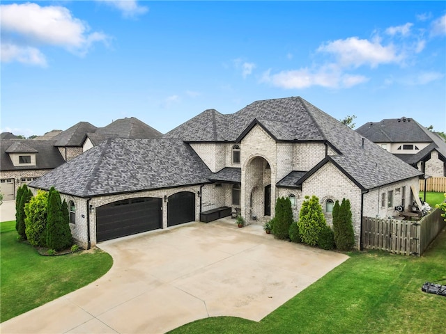 700 SE Yale St, Bentonville, AR 72712 - french country inspired facade with brick siding, an attached garage, and driveway
