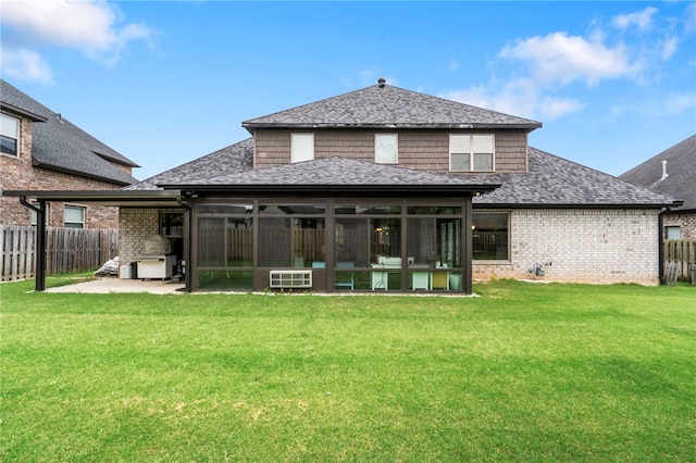 700 SE Yale St, Bentonville, AR 72712 - back of property featuring a sunroom, roof with shingles, a fenced backyard, and a patio area