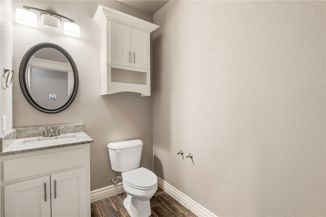 700 SE Yale St, Bentonville, AR 72712 - half bath featuring wood finished floors and vanity