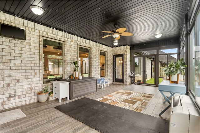 700 SE Yale St, Bentonville, AR 72712 - sunroom / solarium with a ceiling fan