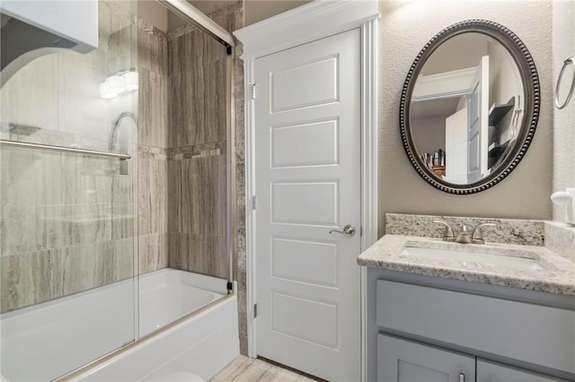 700 SE Yale St, Bentonville, AR 72712 - bathroom with bath / shower combo with glass door and vanity