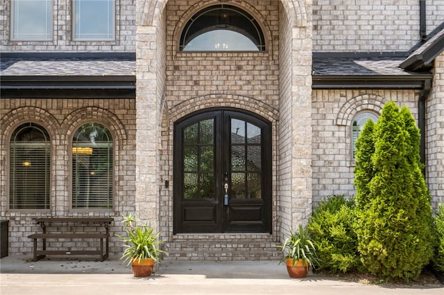 700 SE Yale St, Bentonville, AR 72712 - view of exterior entry with french doors and brick siding