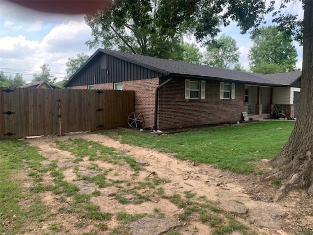 712 Carlton St, Springdale, AR 72762 - view of side of property featuring brick siding and board and batten siding