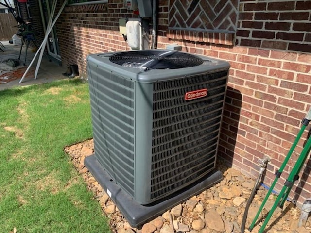 712 Carlton St, Springdale, AR 72762 - exterior view of central AC unit and brick siding