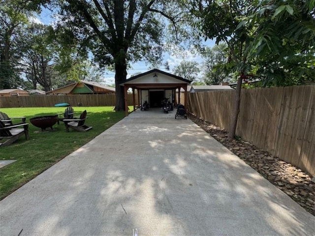 712 Carlton St, Springdale, AR 72762 - view of patio featuring an outdoor fire pit