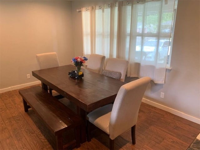712 Carlton St, Springdale, AR 72762 - dining space with baseboards and wood finished floors