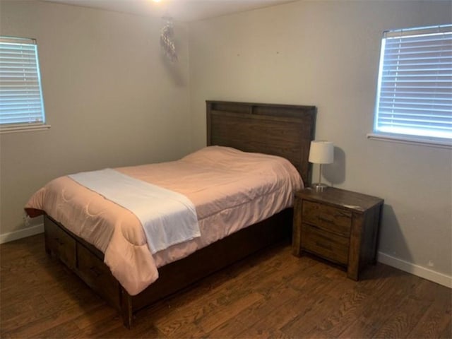712 Carlton St, Springdale, AR 72762 - bedroom featuring wood finished floors, baseboards, and multiple windows