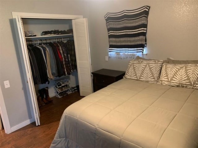 712 Carlton St, Springdale, AR 72762 - bedroom with a closet and wood finished floors