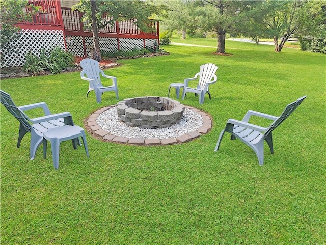 9225 Charles St, Rogers, AR 72756 - view of grassy yard featuring a fire pit and a wooden deck