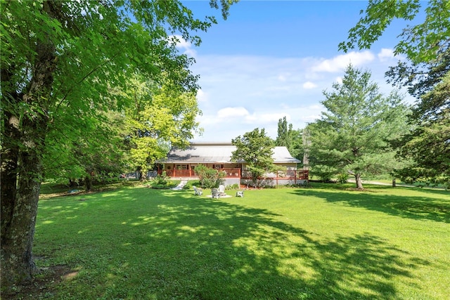 9225 Charles St, Rogers, AR 72756 - view of grassy yard featuring a wooden deck