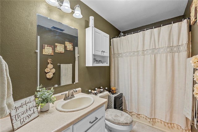 9225 Charles St, Rogers, AR 72756 - full bath with vanity, a textured wall, and shower / tub combo with curtain