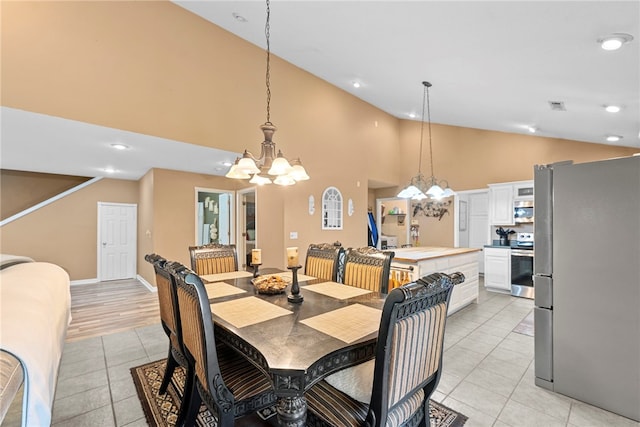 9225 Charles St, Rogers, AR 72756 - dining space with a chandelier, light tile patterned floors, high vaulted ceiling, and recessed lighting