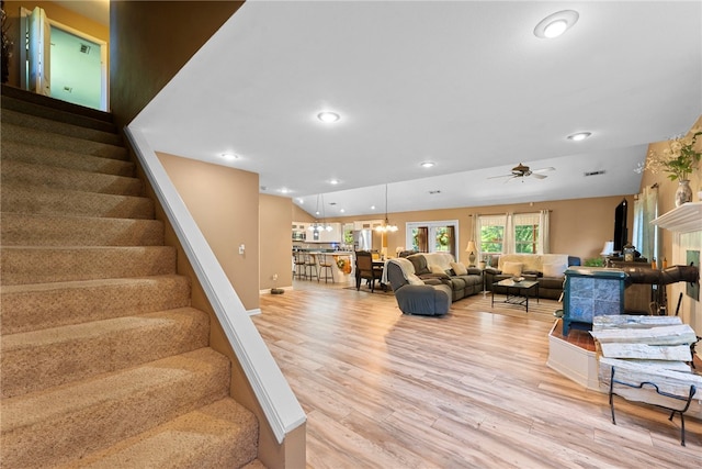 9225 Charles St, Rogers, AR 72756 - living room featuring light wood finished floors, stairway, ceiling fan, and recessed lighting