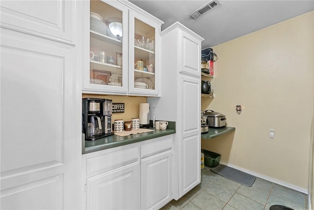 9225 Charles St, Rogers, AR 72756 - bar featuring light tile patterned floors and baseboards