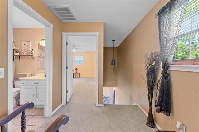 9225 Charles St, Rogers, AR 72756 - hall with light colored carpet and baseboards