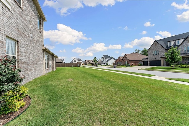 1432 Cannon Ln, Cave Springs, AR 72718 - view of green lawn with a residential view and an attached garage