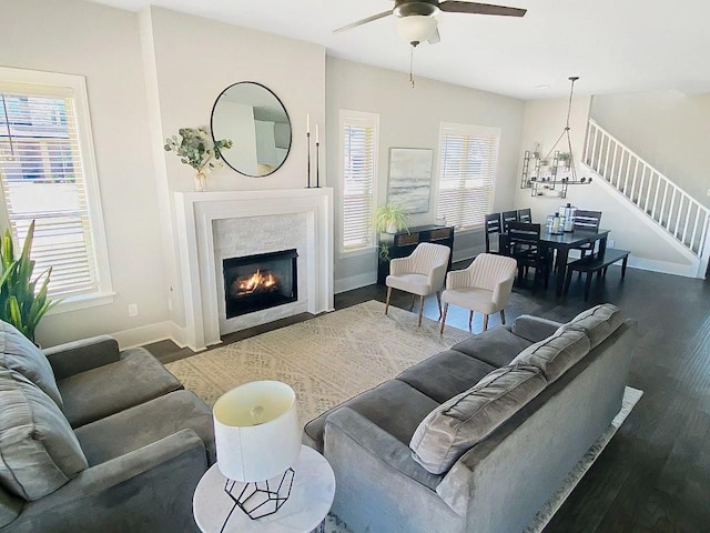 1432 Cannon Ln, Cave Springs, AR 72718 - living area with wood finished floors, stairway, a ceiling fan, and healthy amount of natural light