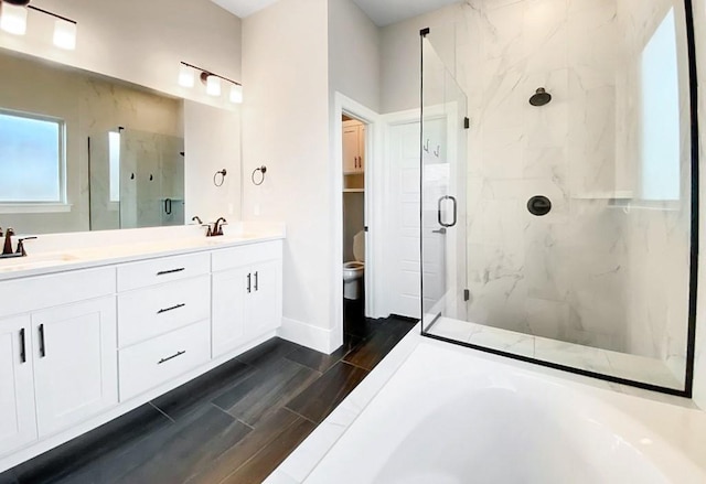 1432 Cannon Ln, Cave Springs, AR 72718 - bathroom with a marble finish shower, double vanity, and wood finish floors