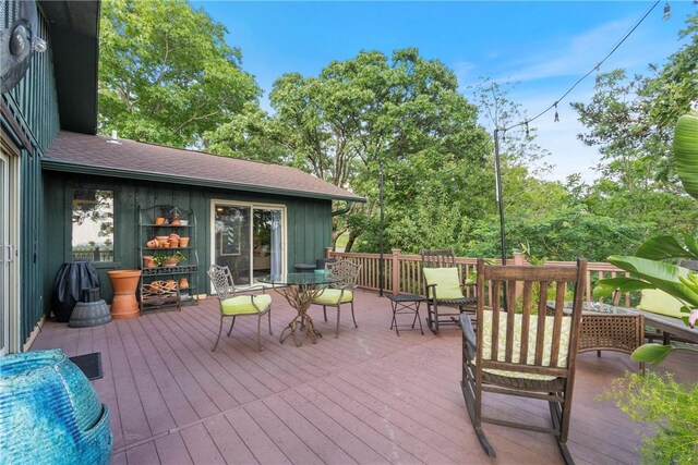 7 El Dorado Dr, Holiday Island, AR 72631 - wooden deck with outdoor dining space