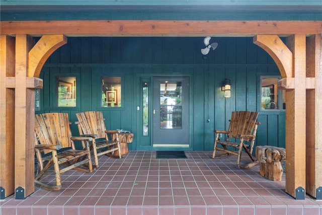 7 El Dorado Dr, Holiday Island, AR 72631 - view of exterior entry with a porch and board and batten siding