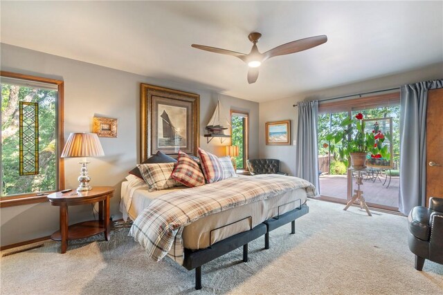 7 El Dorado Dr, Holiday Island, AR 72631 - bedroom featuring access to outside, multiple windows, and light colored carpet