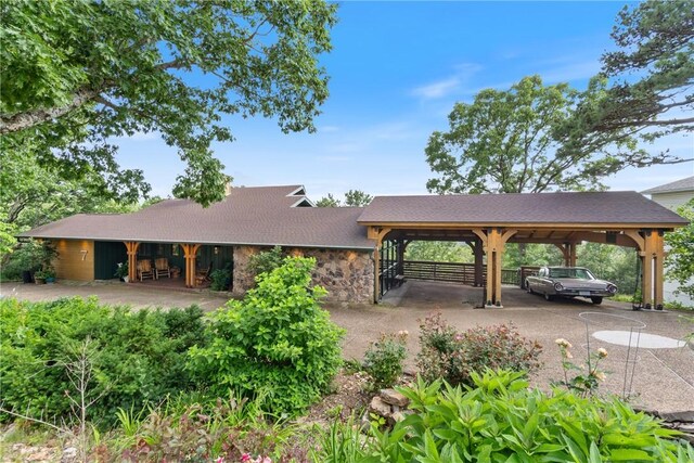7 El Dorado Dr, Holiday Island, AR 72631 - exterior space featuring a carport and stone siding