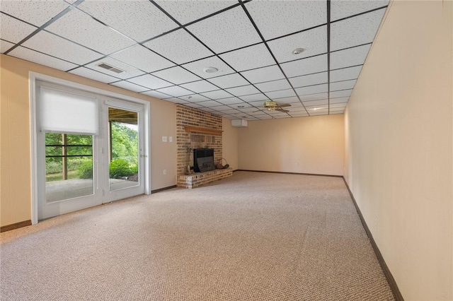 24 Meadow Lark Ln, Harrison, AR 72601 - unfurnished living room with carpet, a brick fireplace, a paneled ceiling, and baseboards