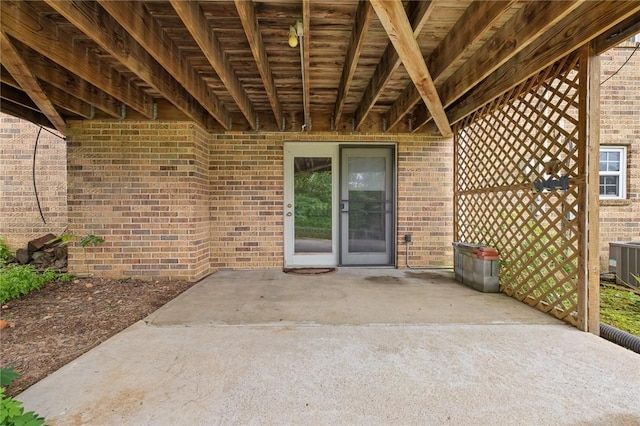 24 Meadow Lark Ln, Harrison, AR 72601 - entrance to property with brick siding, a patio area, and central AC unit