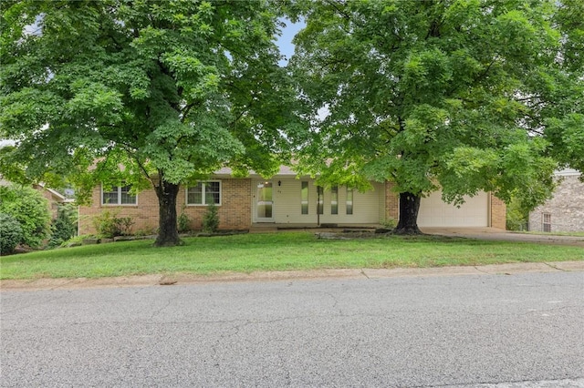 24 Meadow Lark Ln, Harrison, AR 72601 - obstructed view of property with driveway, a front yard, and brick siding