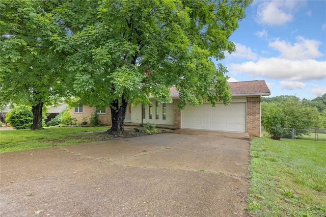 24 Meadow Lark Ln, Harrison, AR 72601 - view of property hidden behind natural elements with brick siding, driveway, and an attached garage