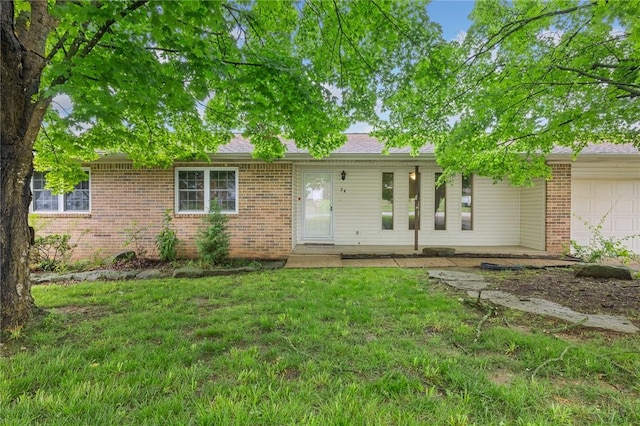 24 Meadow Lark Ln, Harrison, AR 72601 - view of front of property with brick siding, a garage, a front yard, and a shingled roof