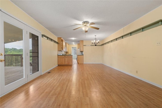 24 Meadow Lark Ln, Harrison, AR 72601 - unfurnished living room featuring a chandelier, light wood-style floors, ceiling fan, baseboards, and a textured ceiling