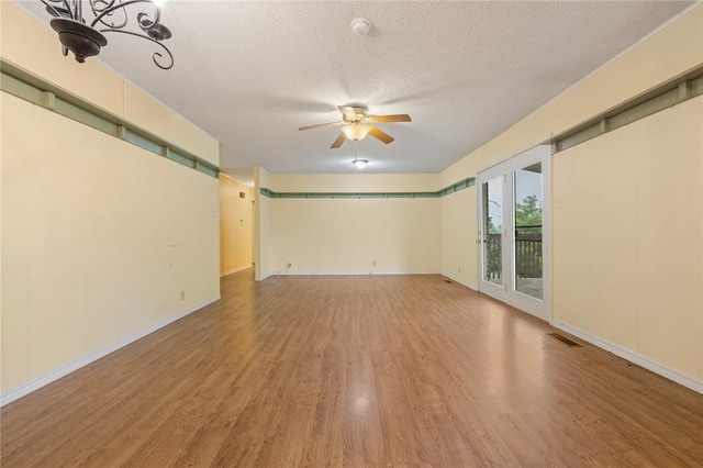 24 Meadow Lark Ln, Harrison, AR 72601 - unfurnished room with wood finished floors, ceiling fan, a textured ceiling, a smoke detector, and baseboards