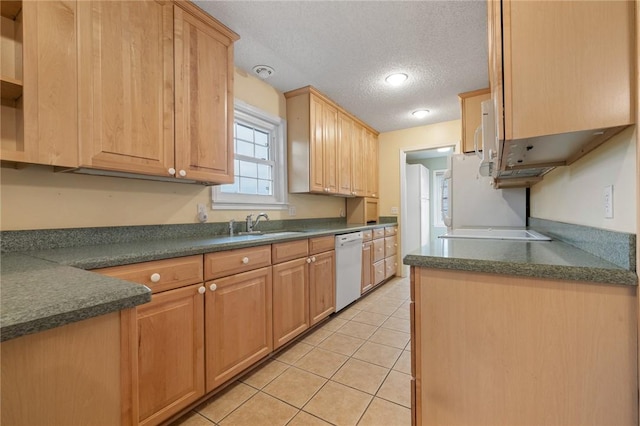 24 Meadow Lark Ln, Harrison, AR 72601 - kitchen with dishwasher, dark countertops, a textured ceiling, light tile patterned flooring, and a sink
