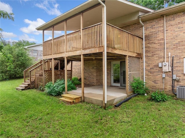 24 Meadow Lark Ln, Harrison, AR 72601 - rear view of property with a patio area, brick siding, a lawn, central AC unit, and a deck