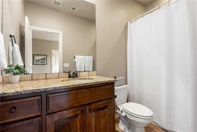 2314 S Mont Blanc Ave, Rogers, AR 72758 - full bathroom featuring toilet, vanity, and tile patterned flooring