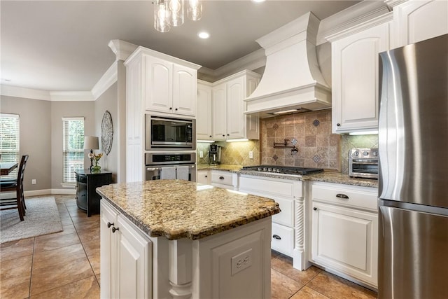 2314 S Mont Blanc Ave, Rogers, AR 72758 - kitchen with appliances with stainless steel finishes, custom range hood, crown molding, tasteful backsplash, and a center island