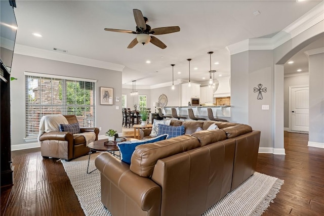 2314 S Mont Blanc Ave, Rogers, AR 72758 - living area with baseboards, a ceiling fan, arched walkways, ornamental molding, and dark wood-style floors