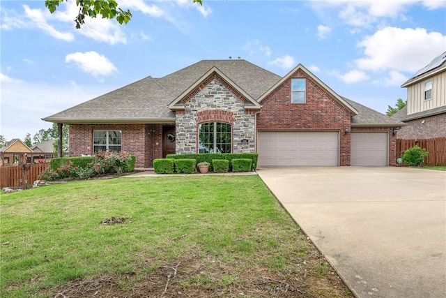 2314 S Mont Blanc Ave, Rogers, AR 72758 - view of front facade featuring a shingled roof, concrete driveway, and brick siding
