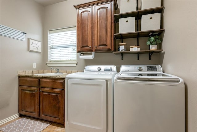 2314 S Mont Blanc Ave, Rogers, AR 72758 - laundry area with washer and dryer, cabinet space, and baseboards
