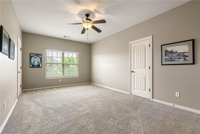 2314 S Mont Blanc Ave, Rogers, AR 72758 - spare room with a ceiling fan, carpet, and baseboards