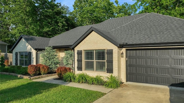 694 Bison Run St, Farmington, AR 72730 - view of front of home featuring an attached garage, a shingled roof, concrete driveway, and a front yard