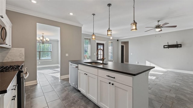 694 Bison Run St, Farmington, AR 72730 - kitchen featuring appliances with stainless steel finishes, dark countertops, a sink, crown molding, and ceiling fan