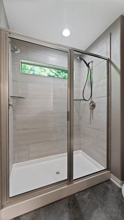 694 Bison Run St, Farmington, AR 72730 - bathroom with a stall shower and tile patterned floors