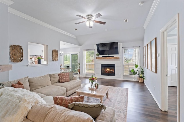 1031 Charles St, Pea Ridge, AR 72751 - living room featuring healthy amount of natural light, dark wood-style flooring, a ceiling fan, a large fireplace, and ornamental molding