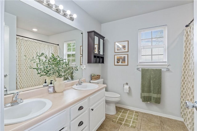 1031 Charles St, Pea Ridge, AR 72751 - full bath featuring double vanity, toilet, baseboards, tile patterned flooring, and curtained shower