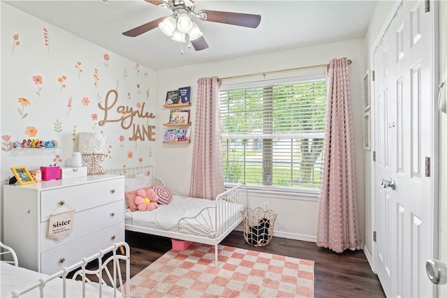 1031 Charles St, Pea Ridge, AR 72751 - bedroom featuring wood finished floors, a closet, multiple windows, and baseboards