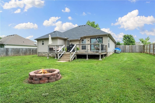 1031 Charles St, Pea Ridge, AR 72751 - rear view of property featuring an outdoor fire pit, a deck, and roof with shingles